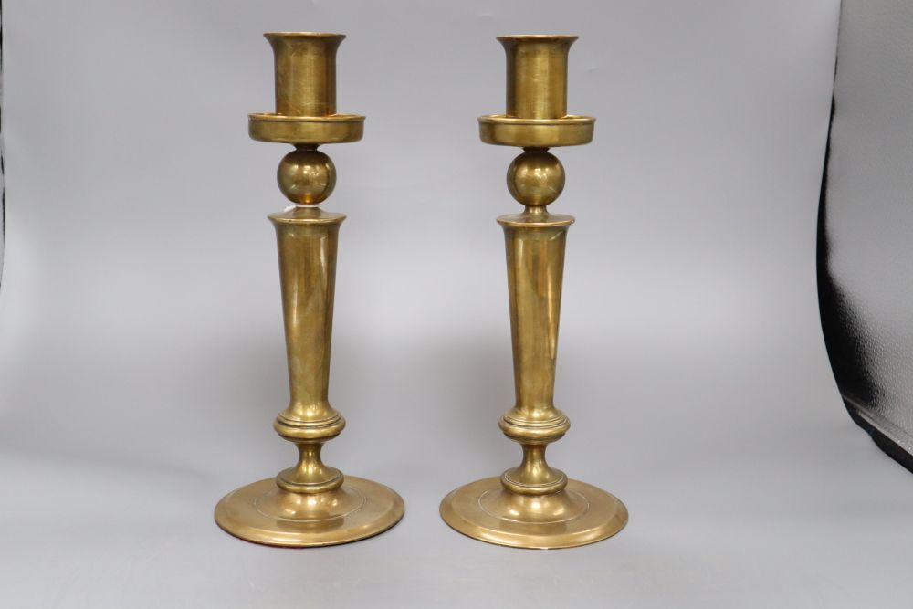 A pair of 20th century bell-metal candlesticks, height 31cm